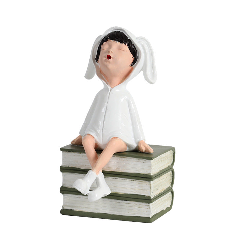 Playful Ceramic Book Figure