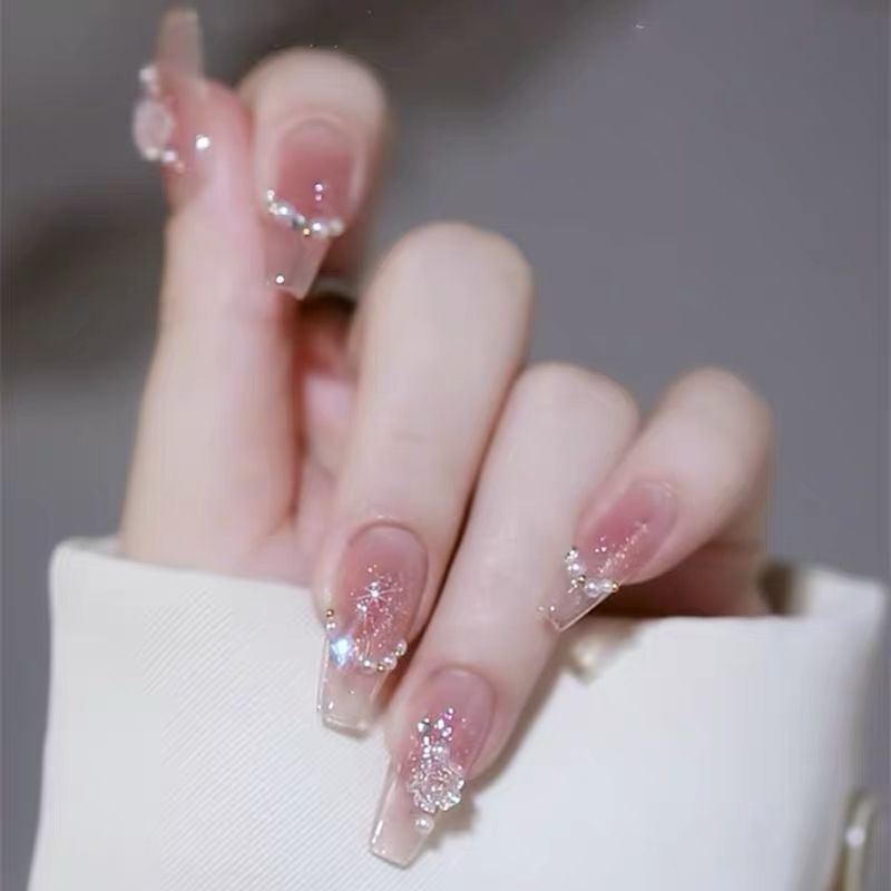 Artificial nails with heart design and glamorous accents Bowlift