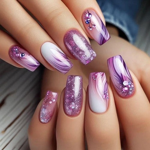 Glamorous artificial nails with filigree glitter decorations Bowlift