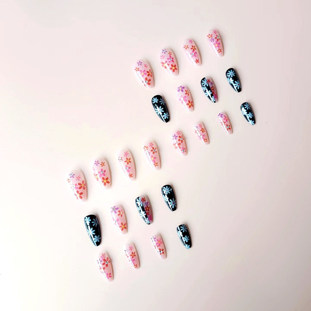 Artificial nail set with floral 3D embellishments and glitter accents Bowlift