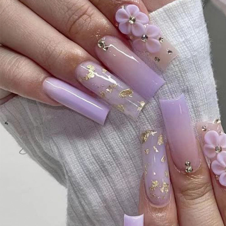 Artistic Gel Nails with Floral Design and Glitter Accents Bowlift