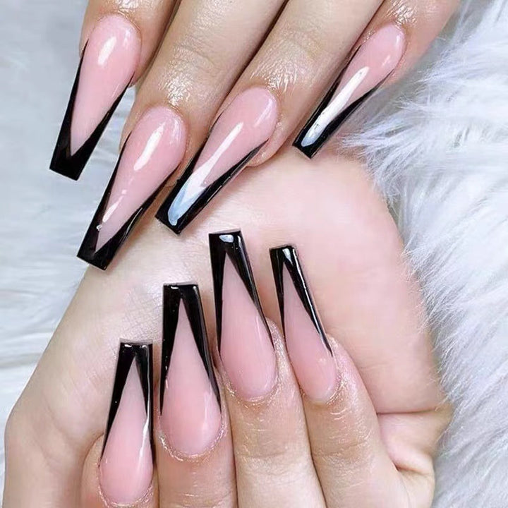 Artificial nail set with elegant stiletto design and glossy accents Bowlift