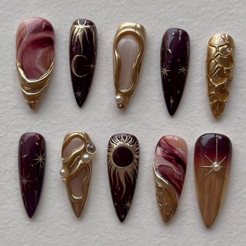 Artificial nail set with elegant gold accents and unique designs Bowlift