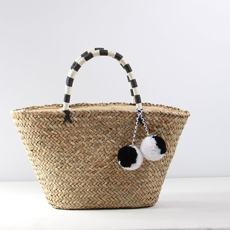 Braided beach bag with decorative pompons Bowlift