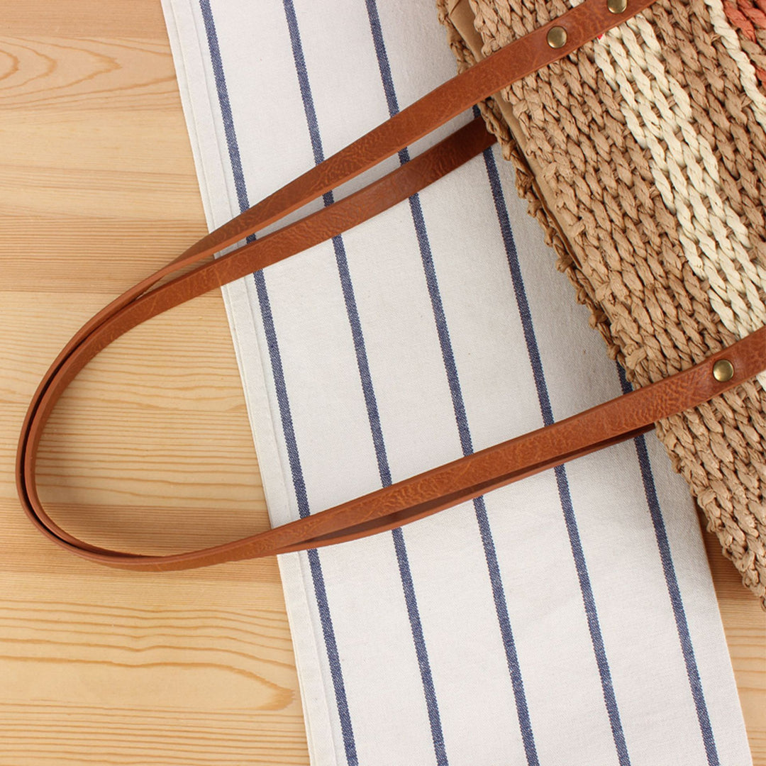 Tote bag made of braided natural material with elegant leather handles Bowlift
