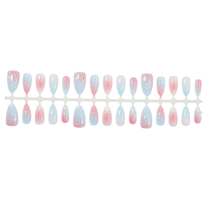 Acrylic nail set with elegant ombre design and floral decorations Bowlift