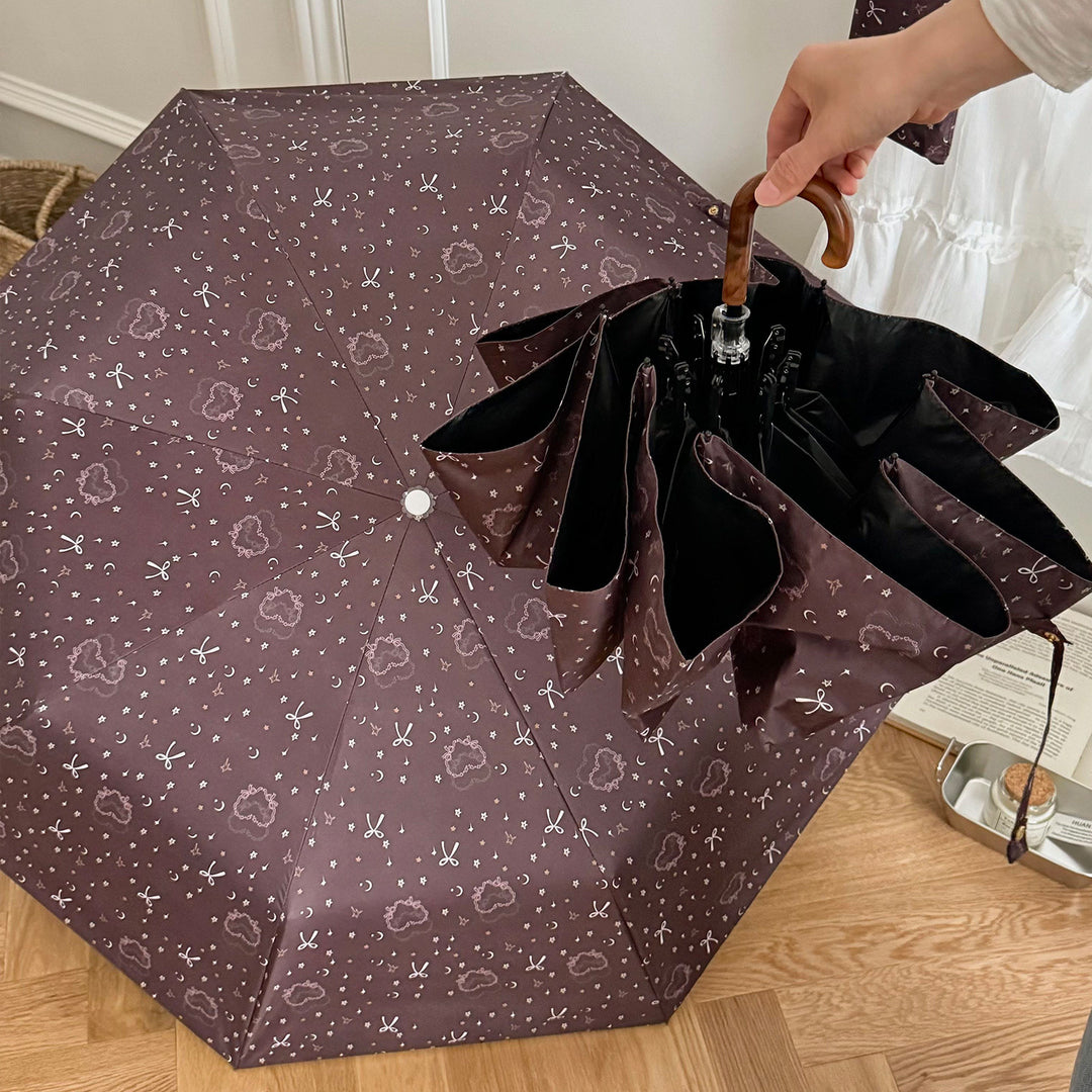 Women's folding umbrella with elegant pendant design Bowlift
