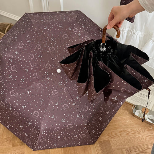 Women's folding umbrella with elegant pendant design Bowlift