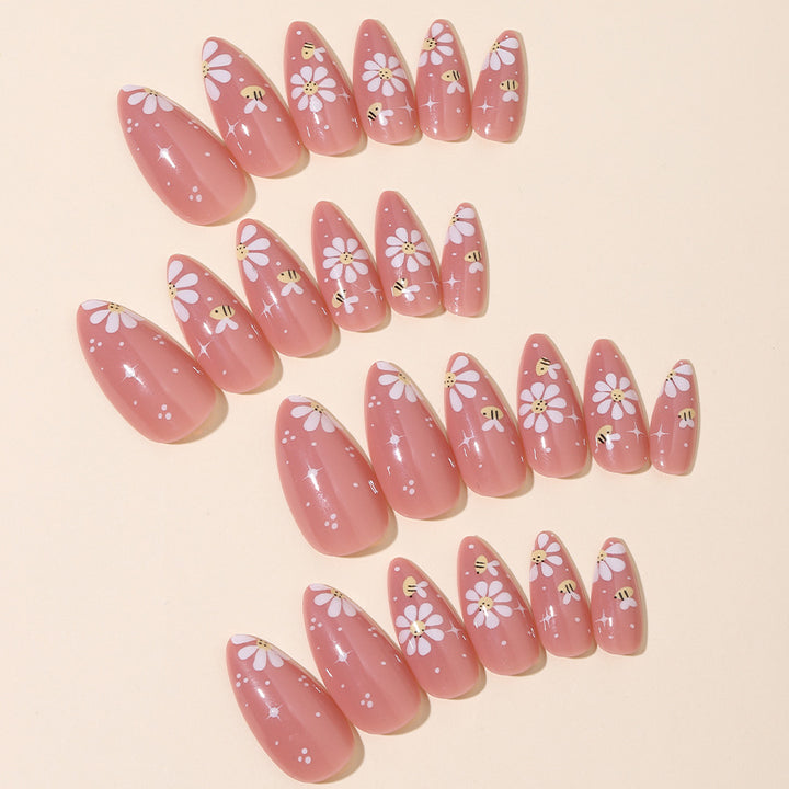 Artificial nails set with elegant flowers and glitter accents Bowlift