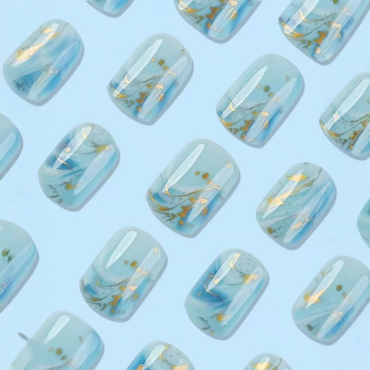 Acrylic nail set with luxurious marble design and gold accents Bowlift