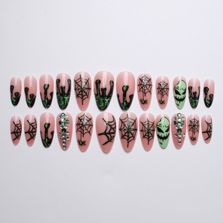 Acrylic nails with Halloween spider design and glitter accents Bowlift