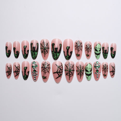 Acrylic nails with Halloween spider design and glitter accents Bowlift
