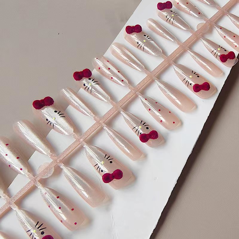 Artificial nails with playful Hello Kitty design Bowlift