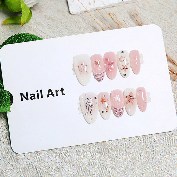 Artificial nails with maritime motifs and pearl embellishments Bowlift