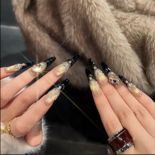 Glamorous artificial nails with extravagant rhinestone and glitter insets Bowlift