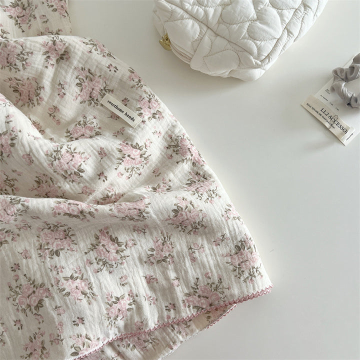 Unisex Muslin Blanket with delicate floral design and elegant ruffles Bowlift