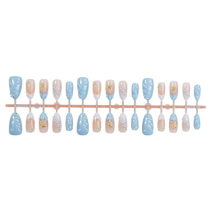 Artificial nail set with glittering accents and floral design Bowlift