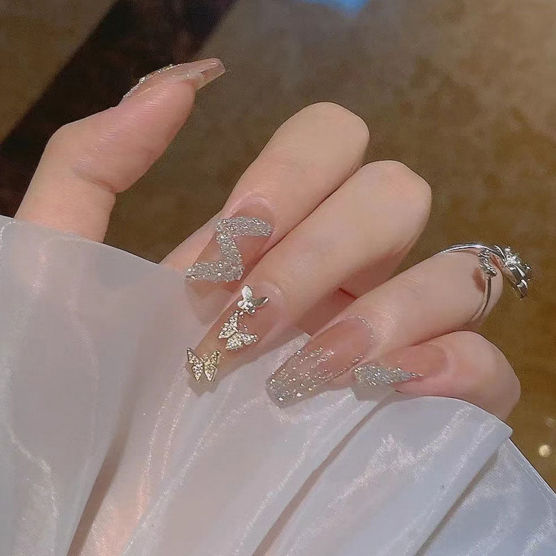 Artificial nails with heart accent and glamorous decorations Bowlift