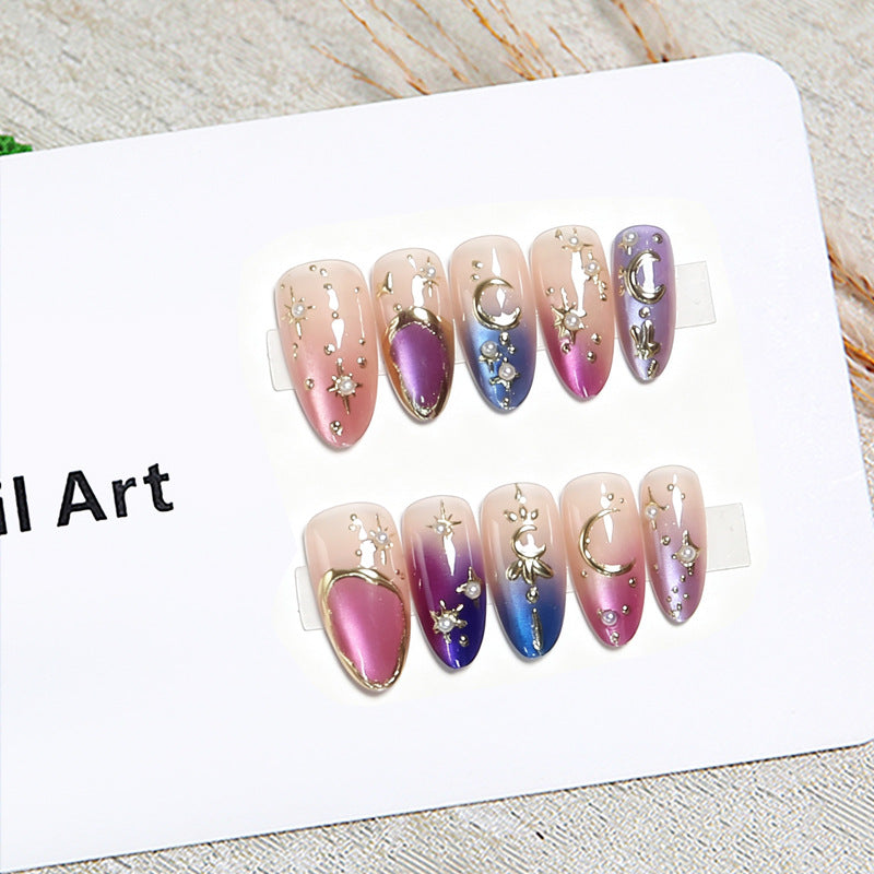 Glamorous artificial nails with star and moon motifs Bowlift