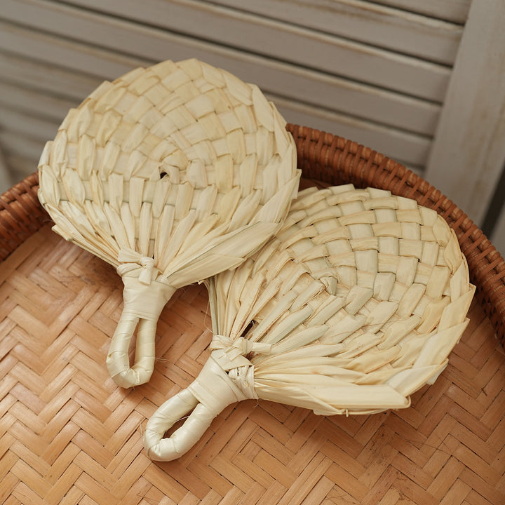Women handmade fan made of natural material Bowlift