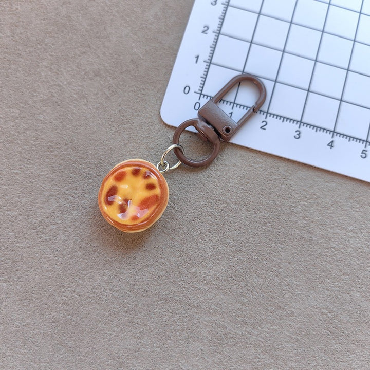 Keychain with cute cake design Bowlift