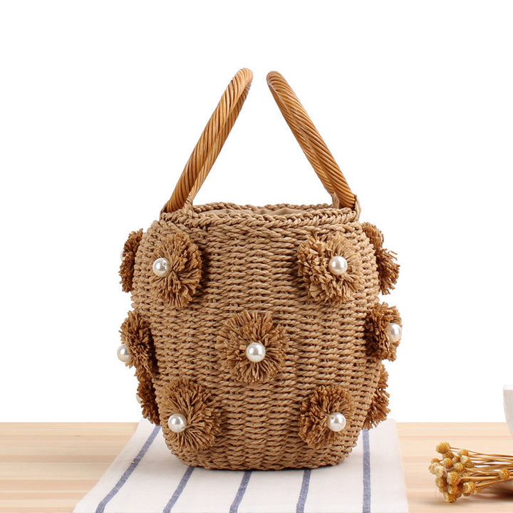Handcrafted basket bag with bead appliqués Bowlift