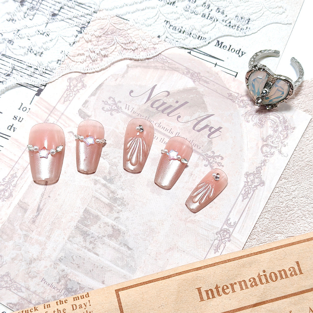 Exquisite artificial nails with glitter and pearl accents Bowlift