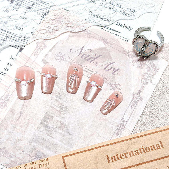 Exquisite artificial nails with glitter and pearl accents Bowlift