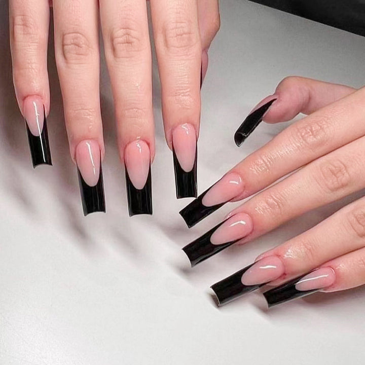 Glamorous artificial nails with modern tips and transparent accents Bowlift