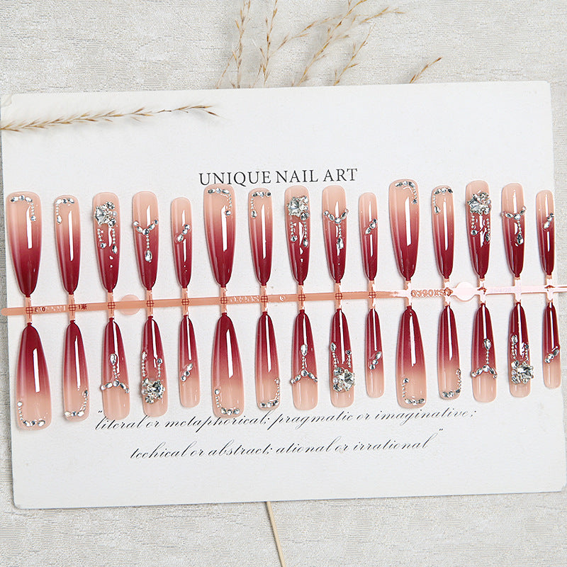 Artificial nails with elegant glitter and jewelry accents Bowlift