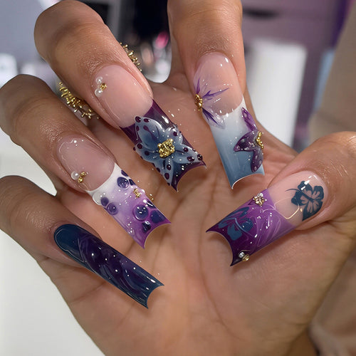 Artistic Long Nail Design with Floral Accents Bowlift