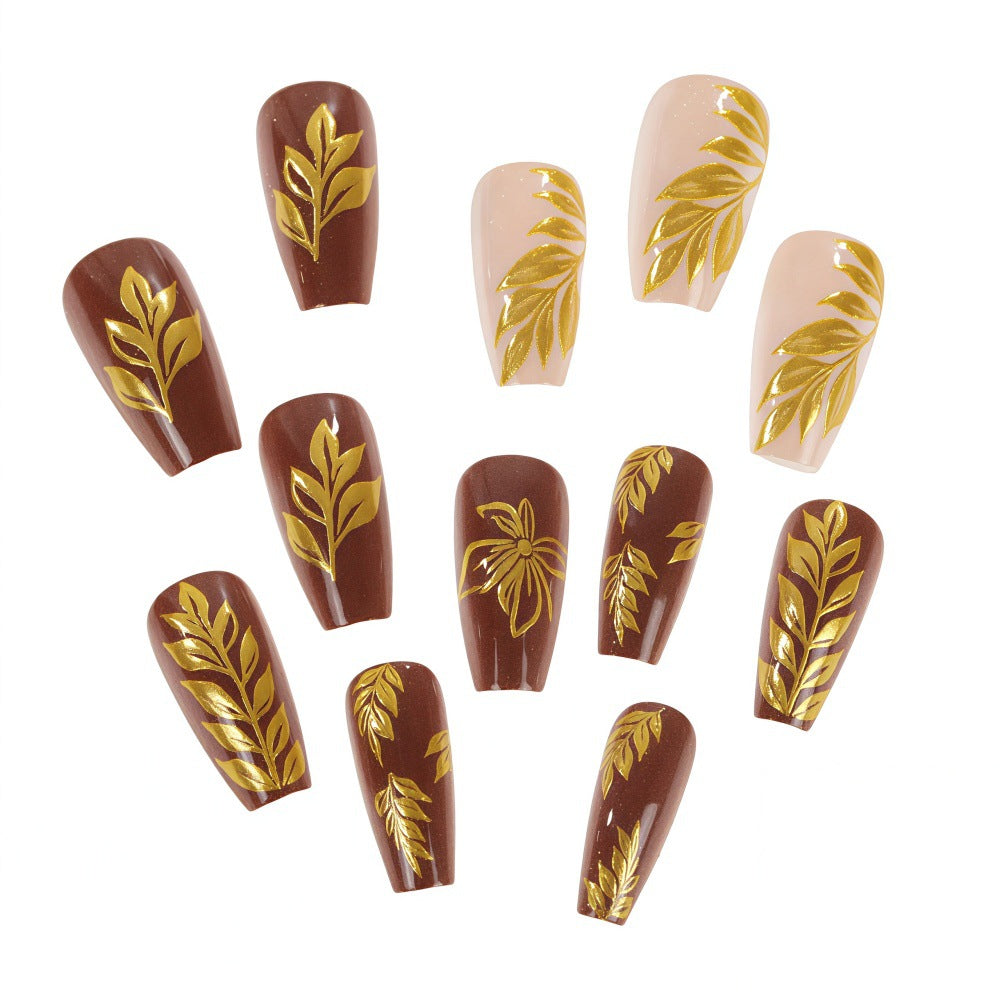 Artificial nails with floral gold design Bowlift