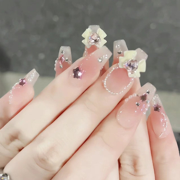 Glamorous artificial fingernails with glitter and moon designs Bowlift