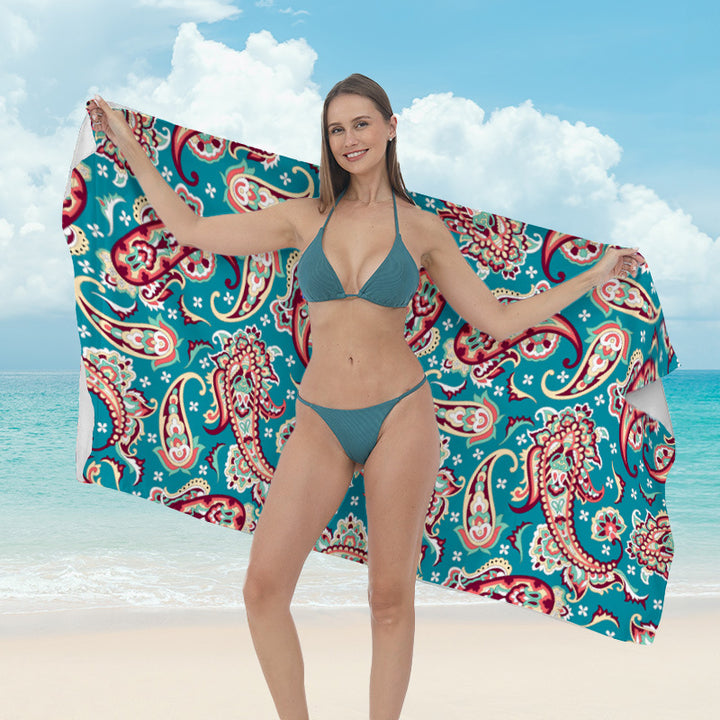 Beach towel with vibrant tropical plant motif Bowlift