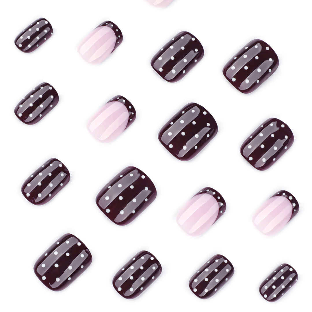 Artful nail art with elegant polka dot design Bowlift