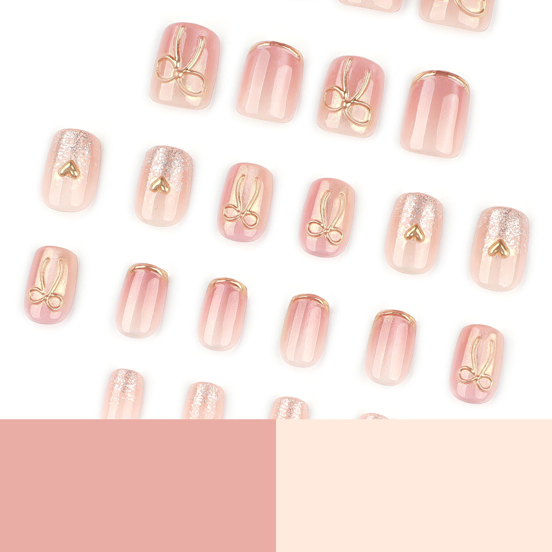 Glamorous acrylic nails with elegant gold design Bowlift