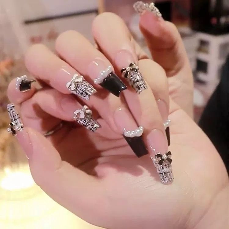 Artistic Nail Art with Glitter and Flower Applications Bowlift