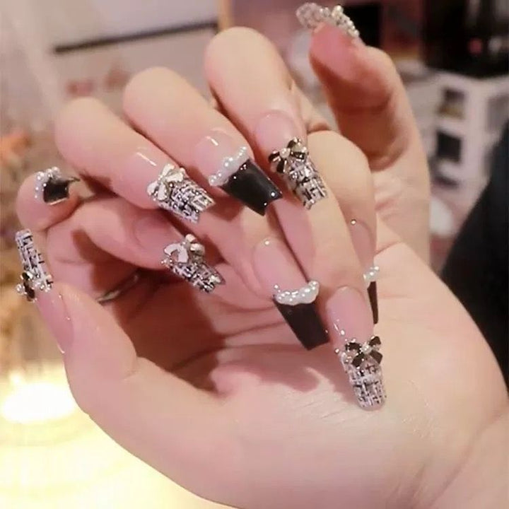 Artistic Nail Art with Glitter and Flower Applications Bowlift