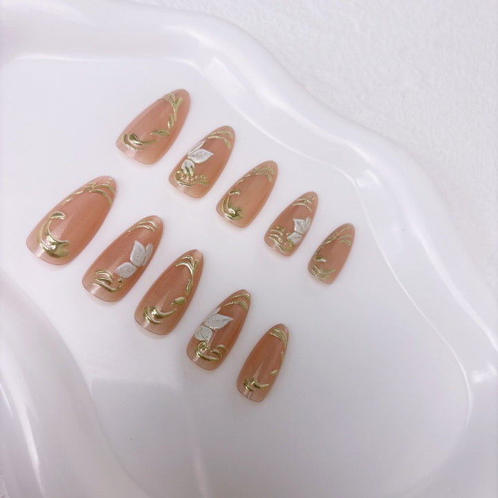 Elegant artificial nails with marble and gold accents Bowlift