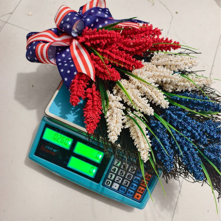 Independence Day tiered faux wildflower door swag with grosgrain stars-and-stripes bow Bowlift