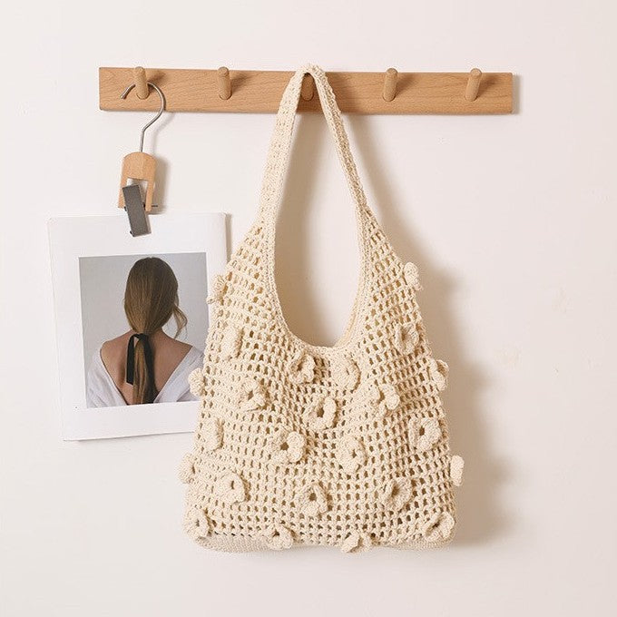 Hand-knotted shoulder bag with floral structural elements Bowlift