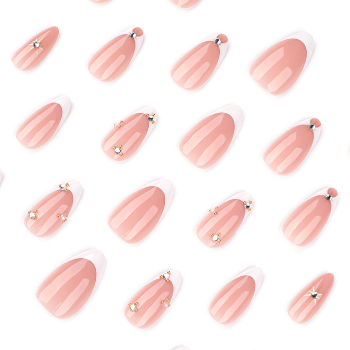 Glamorous nail art with rhinestones and gold accents Bowlift