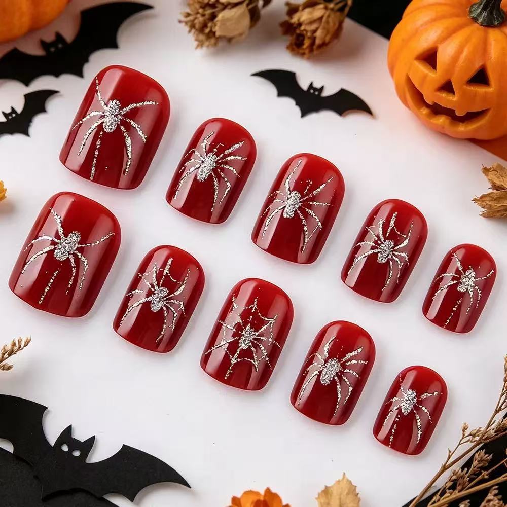 Acrylic nail set with spooky spider and glitter accents Bowlift