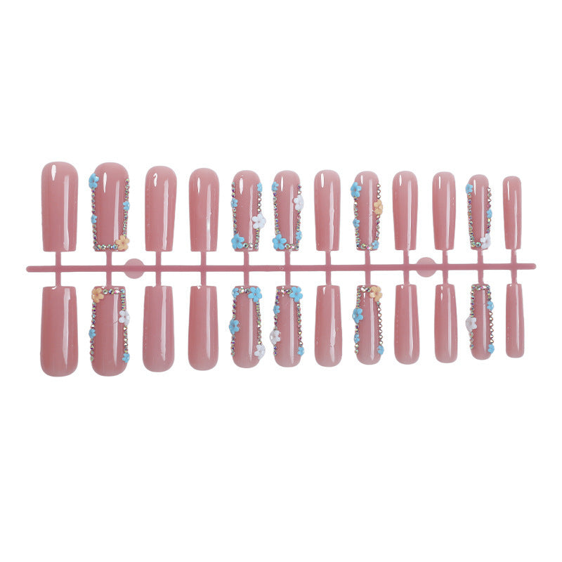 Artificial nail set with delicate flower embellishments and glitter accents Bowlift