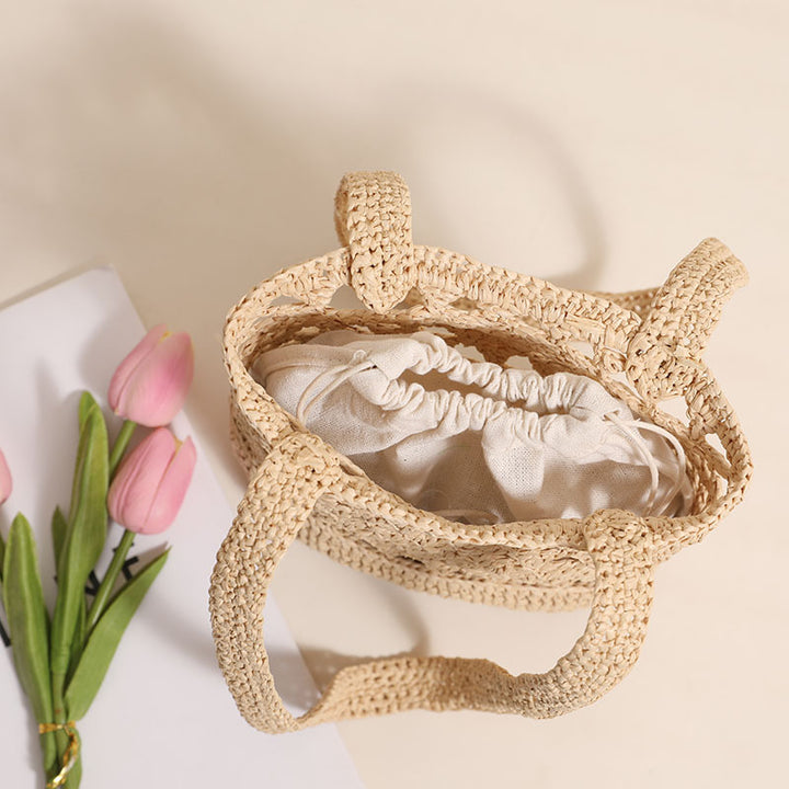 Handcrafted net straw bag with elegant straps Bowlift