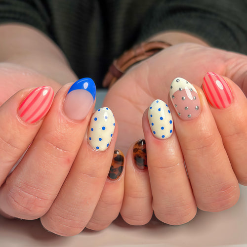 Fake nails in playful design with dots and stripes Bowlift