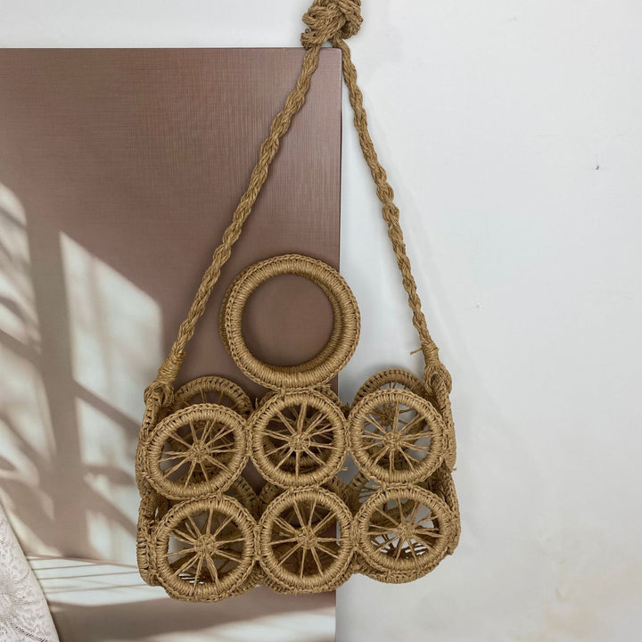 Artisan woven basket bag with striking wheel pattern Bowlift