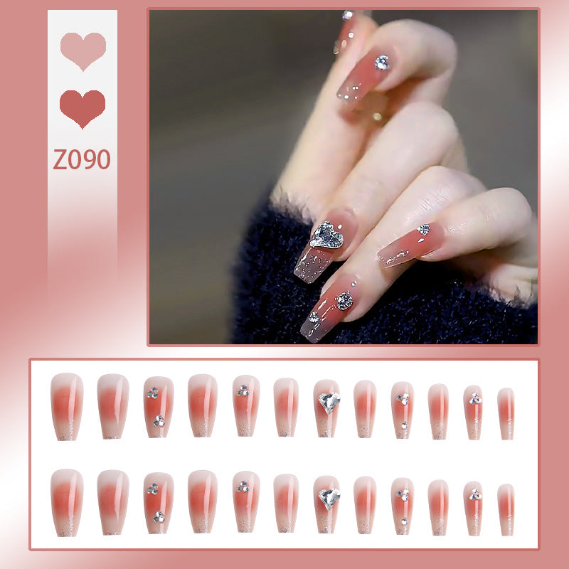 Acrylic nail set with elegant heart and rhinestone decorations Bowlift