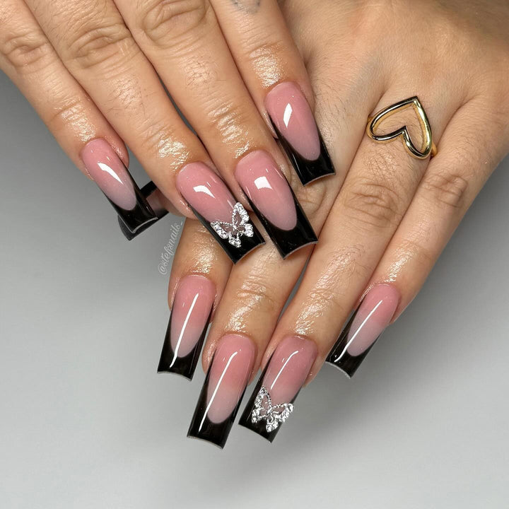 Acrylic nail set with elegant butterfly accents Bowlift