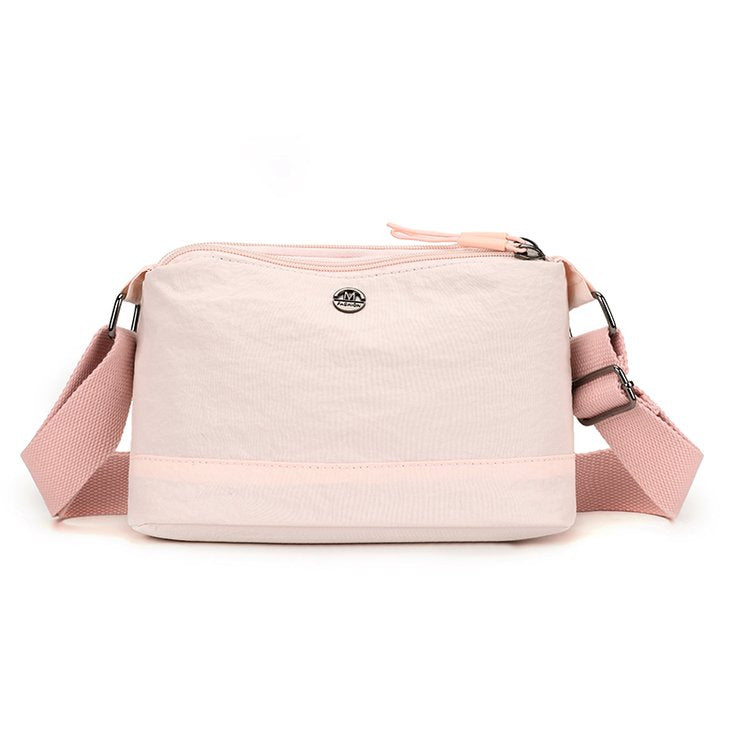Shoulder bag with adjustable carrying strap and intelligent compartment system Bowlift